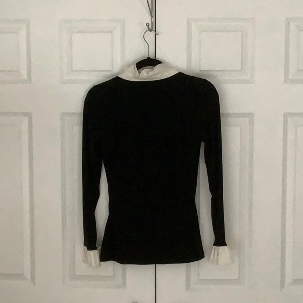 White House black market black top with white ruffled neck and sleeves. - Picture 4 of 6